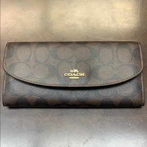 Coach wallet. Brown w/orange Interior.